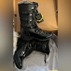 Khombu- Black patent all weather boots. Never worn with box